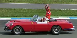 Photograph of Michael Schumacher in a Ferrari 250 GT Cabriolet Pinin Farina on the occasion of the drivers' parade at Hockenheim in 2004.