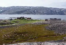 View of the village with the labyrinth in the foreground