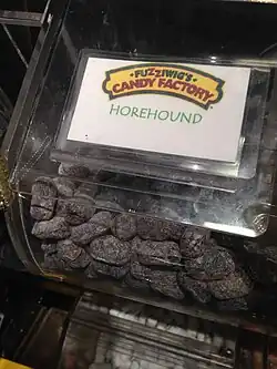 A container of horehound candies / drops from Fuzziwig's Candy Factory