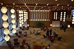 Contemporary hotel lobby with patterned floors and modern lighting