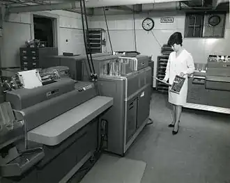 IBM THINK sign at a punched card data processing facility using IBM equipment, c. 1960