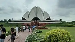 The Lotus Temple was designed by Faribohrz Sahba and completed in 1986. Its design was inspired by the shape of a lotus.[8]