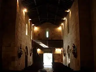 Interior of the Church of São Pedro de Rubiães seen towards the main entrance, with its wooden roof.