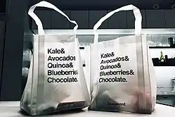 Two bags of groceries on the table