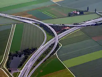 Two level semi-directional T interchange in Orbe, Switzerland. 46°43′42″N 6°34′11″E / 46.72836°N 6.569738°E / 46.72836; 6.569738