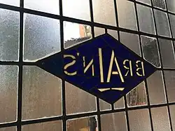 A Brains Brewery logo in stained glass