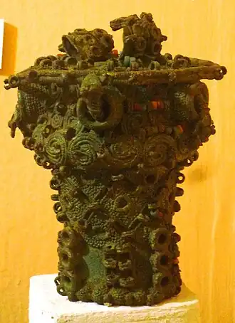 Intricate bronze ceremonial pot with glass beads, 9th century