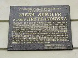 A bronze plaque in Piotrków Trybunalski telling some of her story