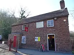 The brick tollhouse at the south end of the bridge