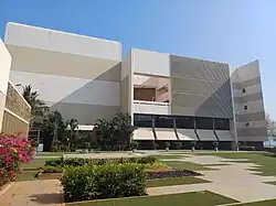 Facade of an auditorium with open garden space in front