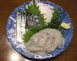 Shimesaba (cured mackerel) and whitebait sashimi with green shiso leaves