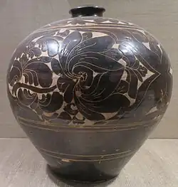 Floral design cut into the slip, 14th century