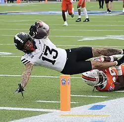 Noel diving for the end zone with the football