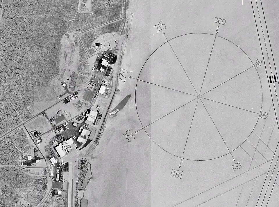 Image 29The world's largest compass rose, drawn on the desert floor at Edwards Air Force Base in California, United States. Painted on the playa near Dryden Flight Research Center, it is inclined to magnetic north and is used by pilots for calibrating heading indicators. (Credit: NASA.) (from Portal:Earth sciences/Selected pictures)