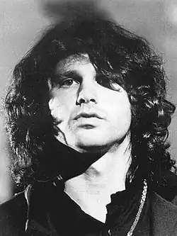 Close-up photograph of Jim Morrison looking into the camera, taken in 1968.