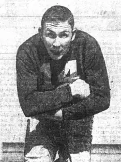 A picture of Johnny Lattner playing football.