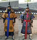Modern reenactors wearing a complete Dujeong-gap set. While conventionally shown as red, the fabric could be of various colors.