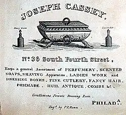 Cassey's barber shop advertisement, 1832; reads "keeps a general assortment of perfumery, scented soaps, shaving apparatus, ladies work and dressing boxes, fine cutlery, fancy hair, pommade, “huil antique”, combs"