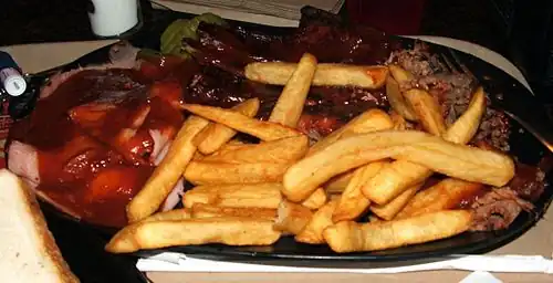 "Combo plate" of several Kansas City-style barbecue dishes and French fries