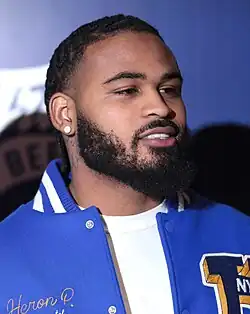 Headshot of Nixon wearing a blue jacket