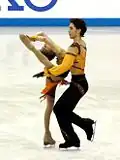 Jana Khokhlova and Sergei Novitski perform an upright/Biellmann spin
