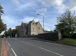 View up the road towards Kirknewton Parish Church
