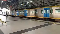 A 1200 class train at Balintawak station in December 2021.