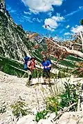 Two hikers at the start of the AV1 near Lago Di Braies.