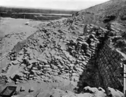 Nearly vertical masonry of mud-brick of the layer pyramid, looking east, 1910