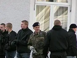 Nationalsocialistisk Front (NSF) holding a demonstration in Växjö, Sweden, with Legion Wasa leader Curt Linusson in camouflage.