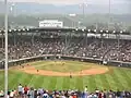 A baseball game in a stadium