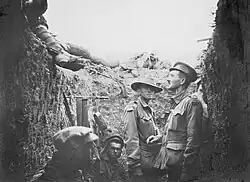 A trench at Lone Pine after the battle, showing Australian and Turkish dead on the parapet, 1915.