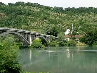 The church and bridge over the Rhône, in Lucey