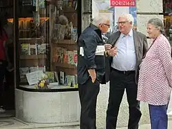 Edward Luttwak holds an issue of Lotta Comunista, Italian Left Communist monthly.