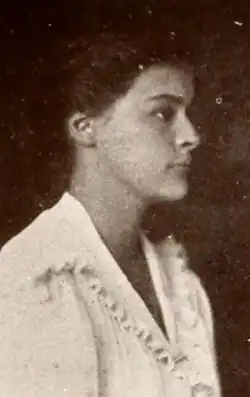 A young white woman, photographed in profile