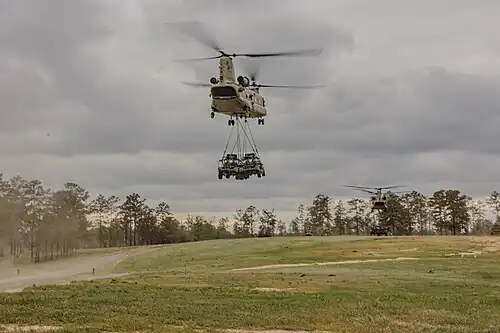 A CH-47 sling-loading two M1301 ISVs
