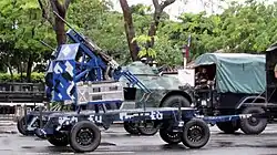 A M39 cannon platform being towed by a Kia KM450 light truck