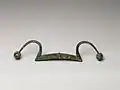 Chinese bronze rein holder, ca. 11th century BCE. The span is 38.7 cm.[7]