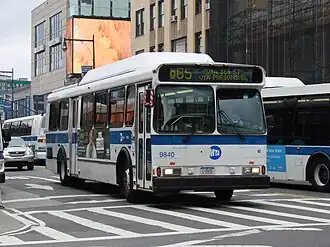 A Q65 bus outside the station, at Main Street and Roosevelt Avenue