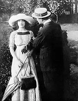 Black and white photograph showing actress Mabel Normand with actor Harry Hyde in period costume