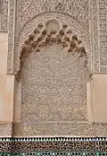 One of the niches on the walls of the courtyard with stucco carved into muqarnas