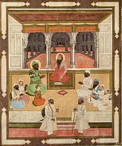 Maharajah Karam Singh of Patiala and his son Narinder Singh with a holy man