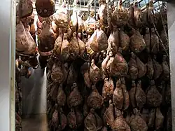 Bayonne hams aging in an atmospherically-controlled storage room in Mazerolles, Béarn