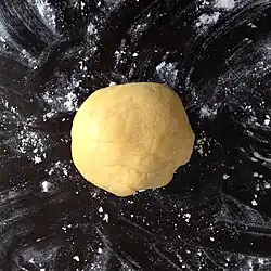 The mixture is kneaded into a ball of dough.