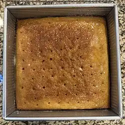 Malva pudding showing the holes into which the glaze is poured