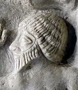 A prisoner from Lagash on the Victory Stele. The same hairstyle can be seen in other statues from Lagash.[40][38]