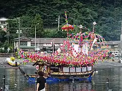 Boat decorated with colorful flowers.