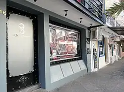 Photograph of the exterior of multiple storefronts