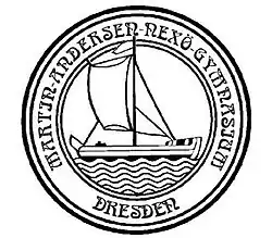 Logo for the school - a black and white drawing of a ship in a circle with the name of the school written around the outside