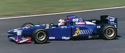Martin Brundle Driving the JS41 in its non-tobacco livery at the 1995 British GP
